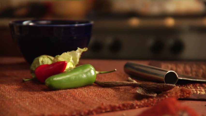 slow pan over peppers and a mountain of mexican spices