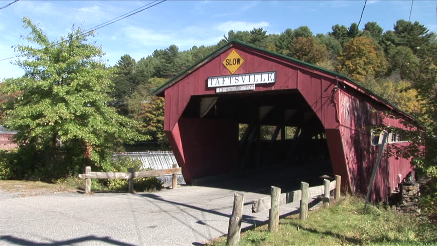Montpelier, Vermont - CIRCA September 2007: A car drives out of a covered bridge in the town of Taftsville