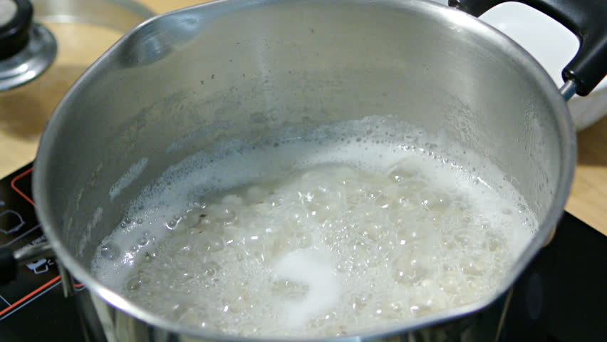 Cooked millet boiled in a stainless pot