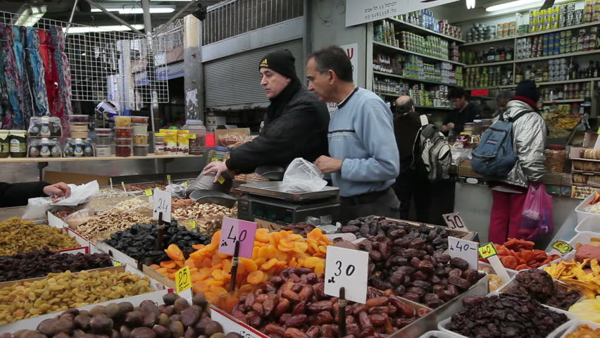 TEL AVIV, ISRAEL - CIRCA MAY 2011: a closeup of a vendor in Shuk HaCarmel market
