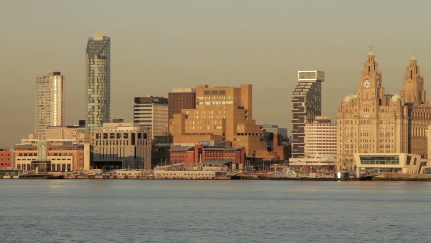 Slow pan across the Liverpool skyline in warm evening light
