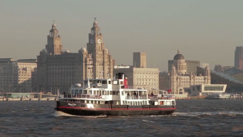LIVERPOOL, MERSEYSIDE - JANUARY 16: Panned clip of The Royal Iris mersey ferry which sails past the UNESCO Liverpool waterfront on January 16, 2012 in Liverpool, England.
