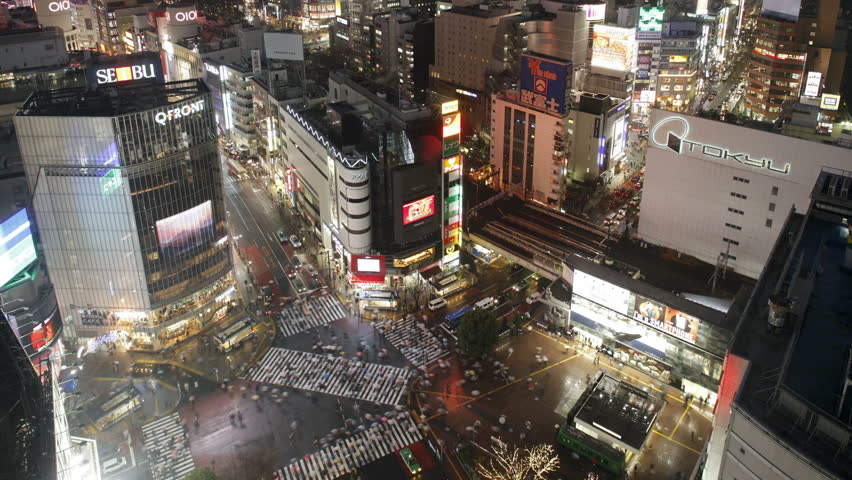 TOKYO, JAPAN - CIRCA MAY 2011: shot pedestrians and traffic across Shibuya Crossing