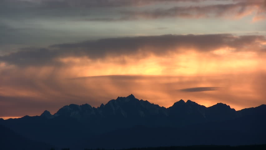 Time lapse of beautiful sunset over Olympic mountains
