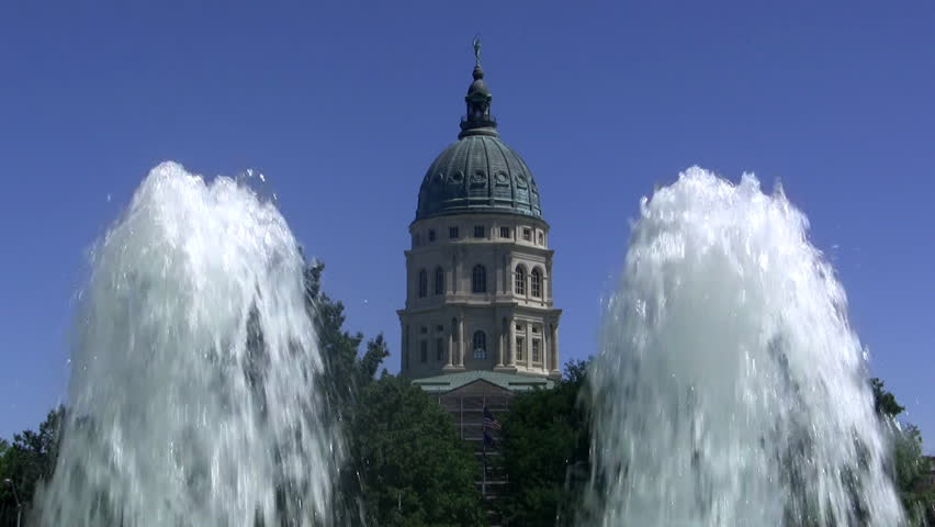 Looking through the Fountains of Justice at the dome on top of the Capital Building in Topeka, KS.