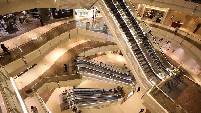 Escalators in shop. City life background.