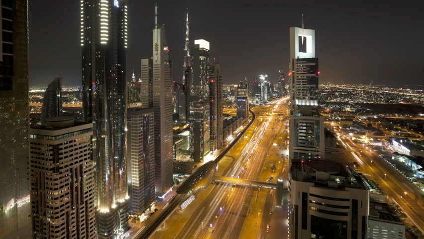 DUBAI, UNITED ARAB EMIRATES - CIRCA MAY 2011: Sheikh Zayed Rd, showing the new MTR track and station system and the Burj Khalifa, the worlds tallest building