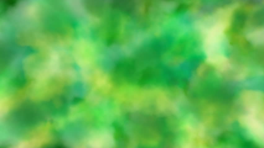 Yellow, green cloud-like forms changing shape and moving.