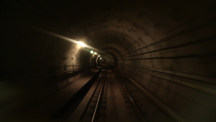 View of a subway tunnel as seen from the front of a moving train