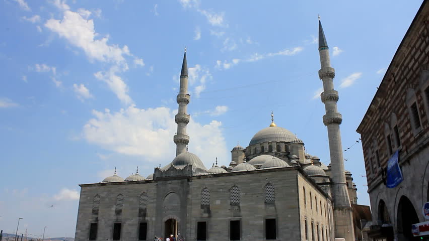 ISTANBUL, TURKEY - 25 July 2012: The Yeni Cami (The New Mosque) is an Ottoman imperial mosque located in the EminÃ¶nÃ¼ district of Istanbul, Turkey.