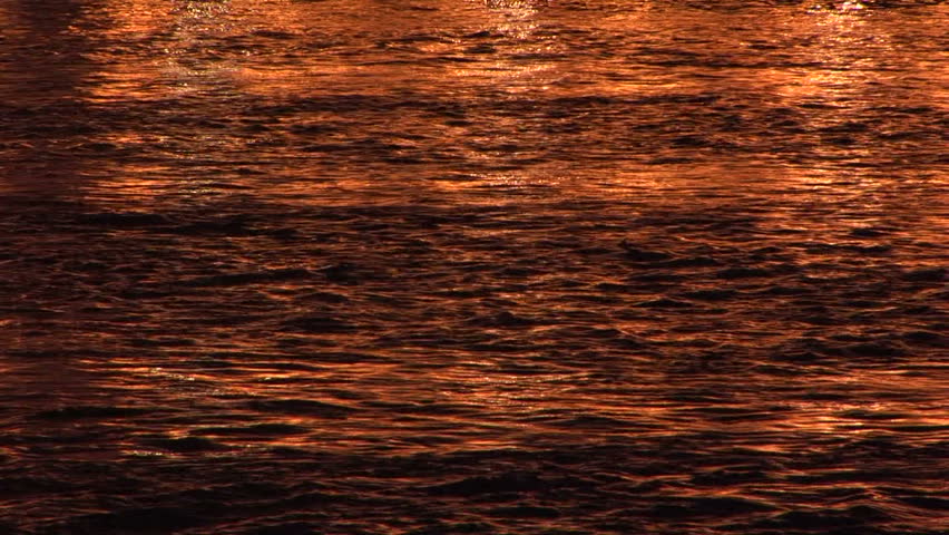 River Thames at night with golden reflective tones London, UK