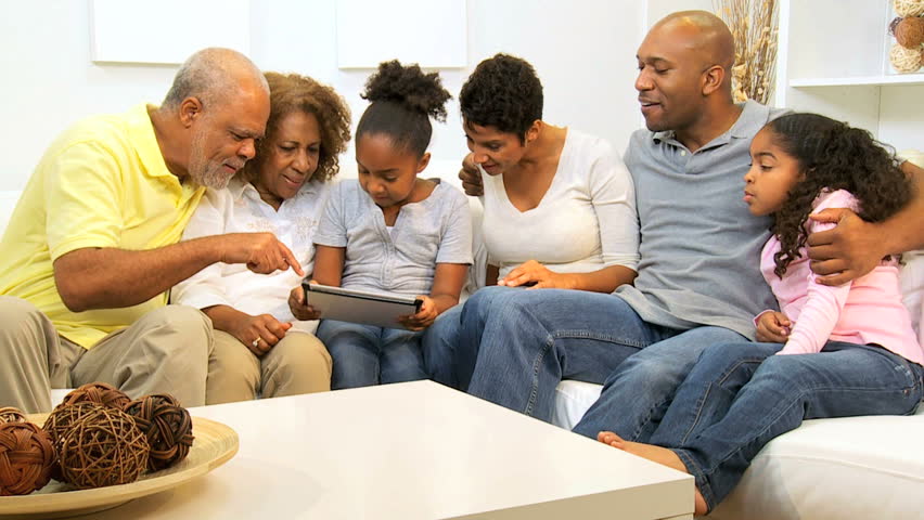 Little ethnic sisters touch screen tablet parents grandparents