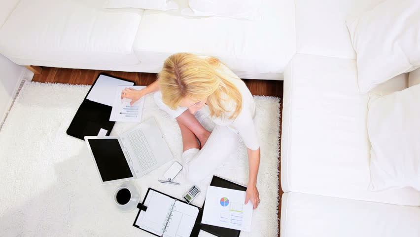Blonde freelance business advisor working home against the clock contract deadline