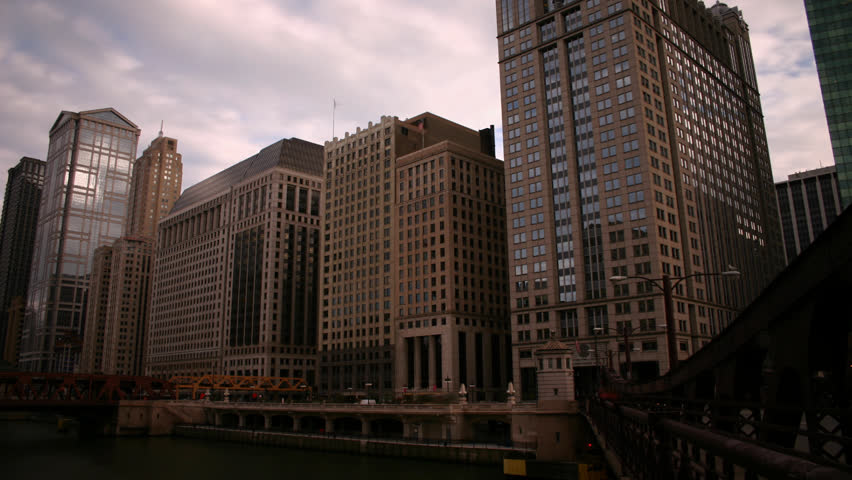 Time lapse RL pan of busy Chicago River urban canyon