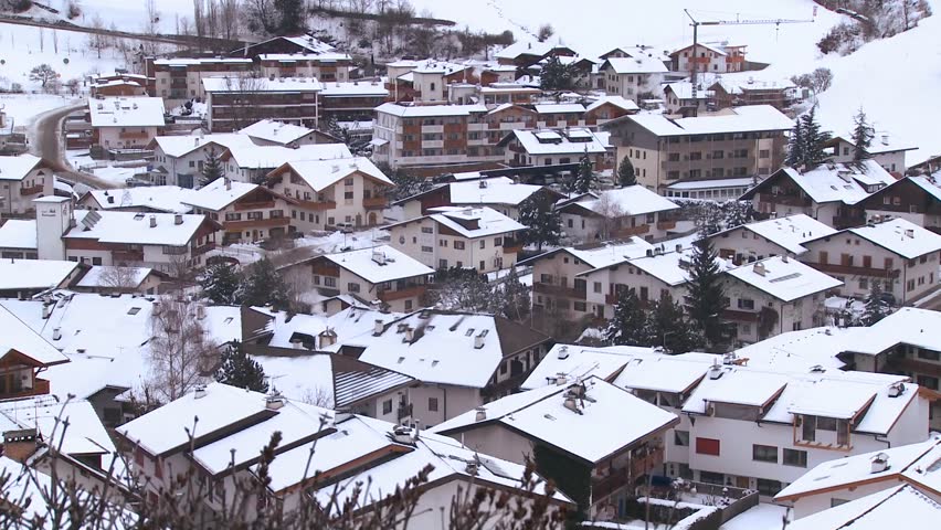 SWISS ALPS, SWITZERLAND-CIRCA 2011-A small European village is buried in a snowstorm.