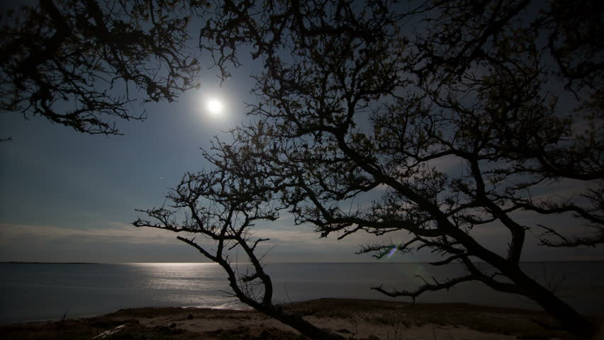 Hi Def Moon and Clouds over Water Time Lapse at Night with dolly motion