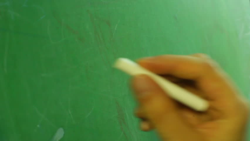Doing math problems on a chalk board
