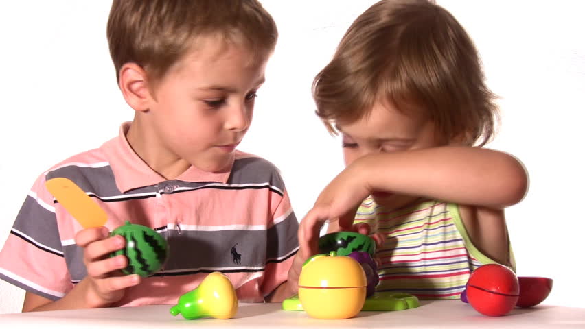 brother with sister with plastic fruits 
