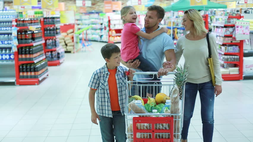 Parents and kids doing shopping together expressing their love and tenderness