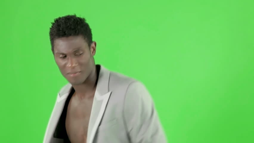young cool african guy waving and dancing with an elegant suite on a chroma key