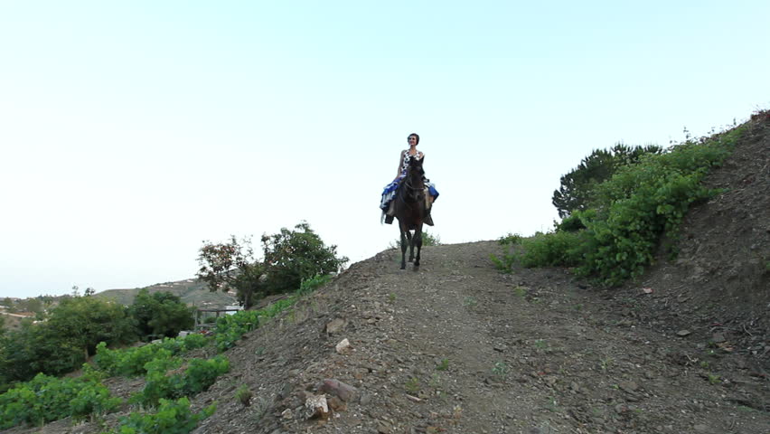 Woman riding a horse in Andalusia, Spain