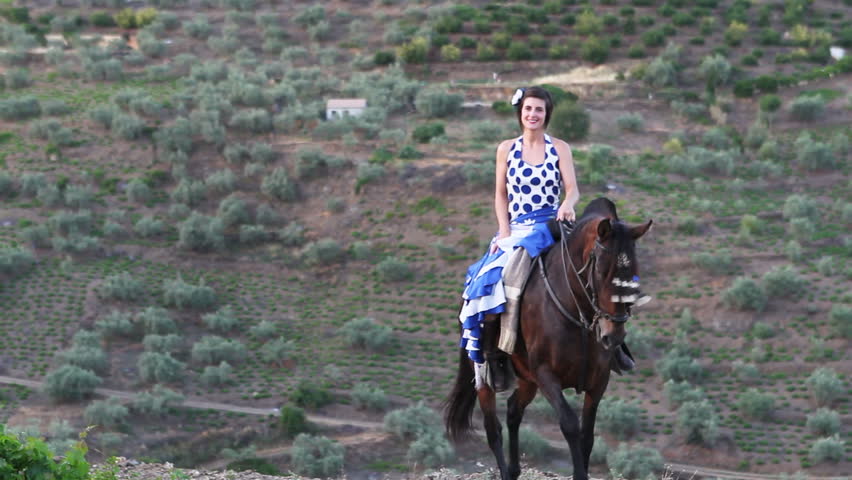 Woman riding a horse in Andalusia, Spain