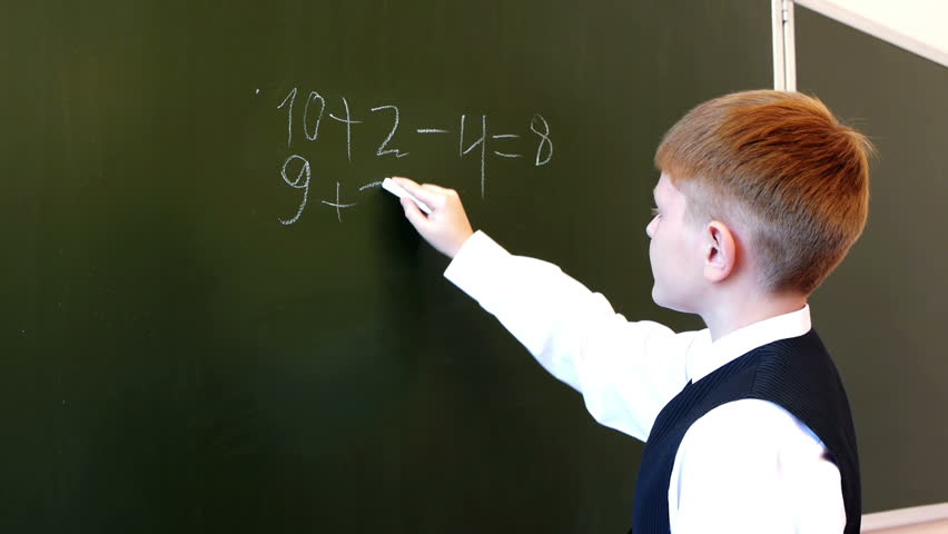 Serious schoolboy accounting equation during mathematic exam
