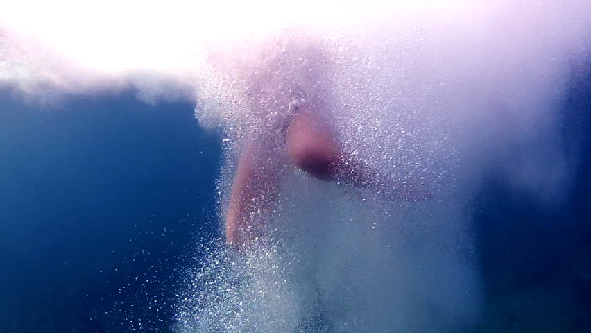 Girl jumping into water. 