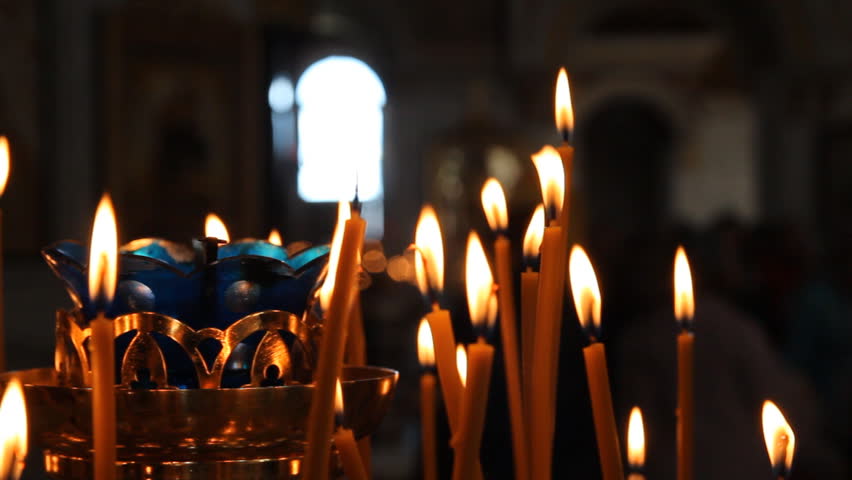 Russian Orthodox Church. Burning candles on a candlestick
