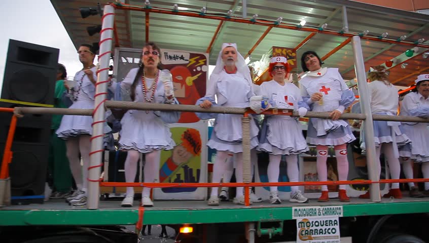 LAS PALMAS DE GRAN CANARIA, SPAIN - FEBRUARY 18: 200,000 masked revelers and a hundred or so festooned cars and floats in the Grande Parade (Gran Cabalgata ) of the Carnival February 18, 2012, Spain 
