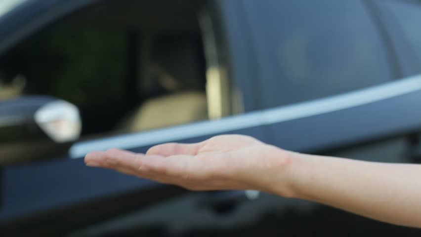 Receiving keys of new status car from dealer