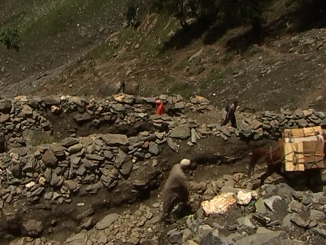 Pilgrimage to the holy Amarnath cave in the Himalayas on narrow twisting road