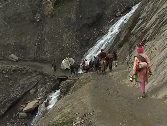 Pilgrimage to the holy Amarnath cave in the Himalayas passing waterfall