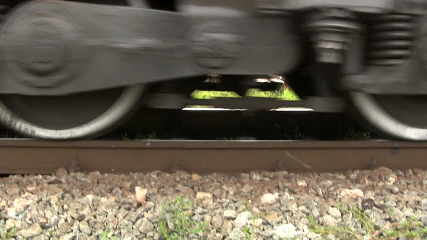 Going wheels of an old train largely. Sound.