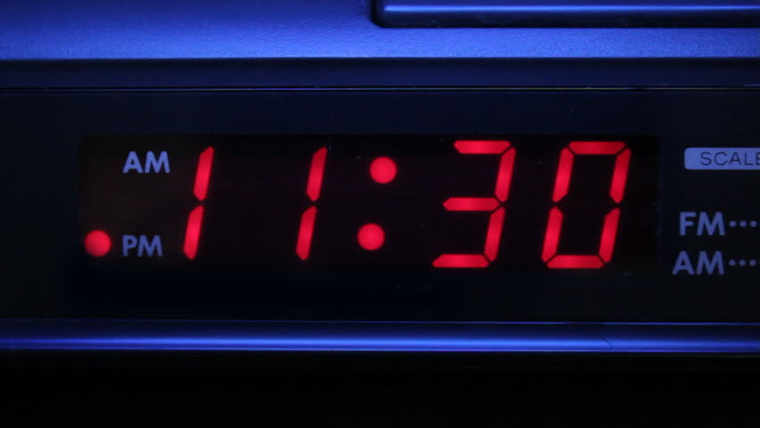 Closeup video of alarm blinking in morning and at night