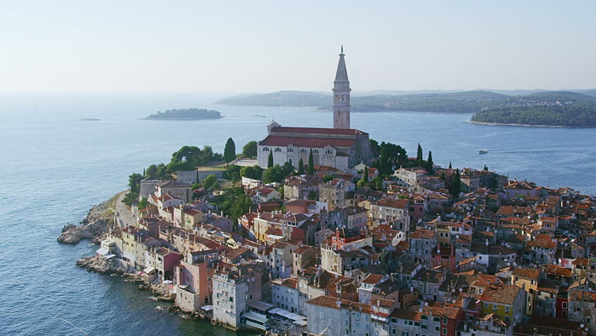 Slow motion aerial shoot of Old town Rovinj at sunset, Istra region, Croatia.