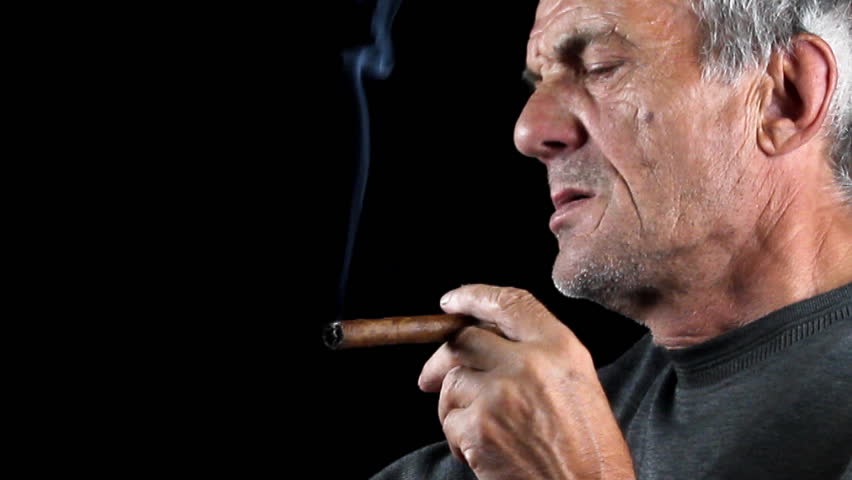 Man smokes cigar