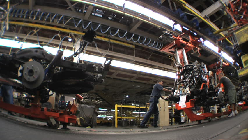 ARLINGTON, TEXAS - Auto workers attaching engines to frames at the General Motors Assembly plant in Arlington, Texas, August 2007.