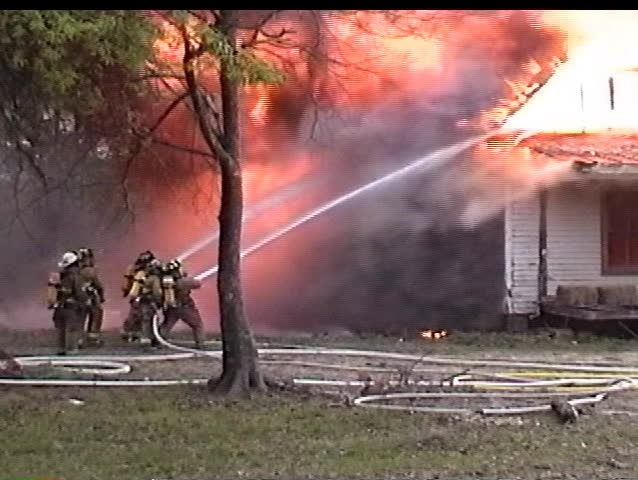 Firemen fighting a house fire
