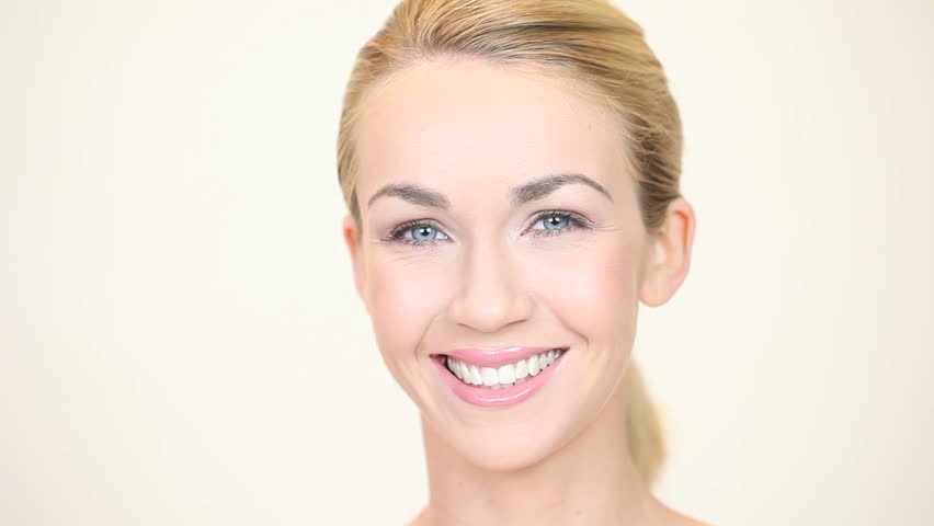 Blonde woman smiling facing forwards
