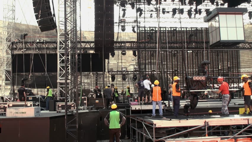 VERONA, ITALY - MAY 10:  Worksmen assembling a stage at the arena of Verona on May 10, 2012. The arena is the second largest roman amphitheater in the world and famous for its musical performances.