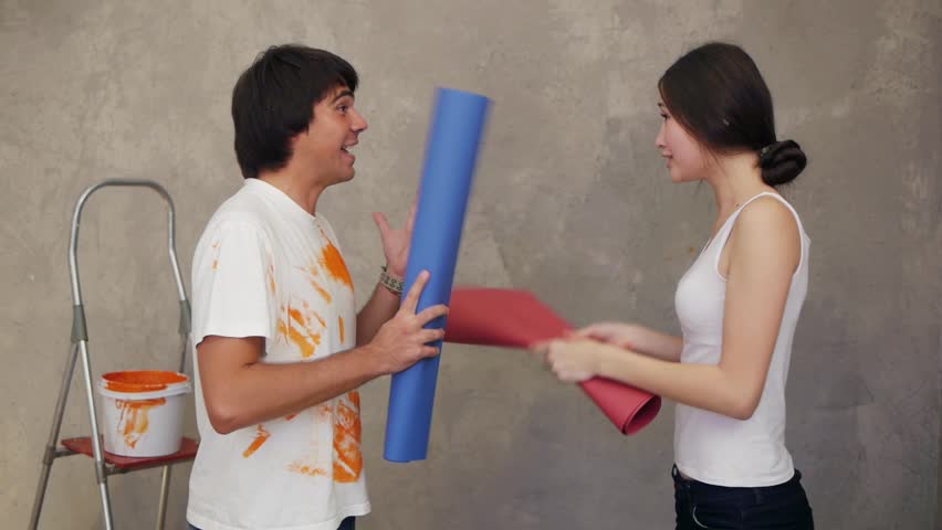 Attractive couple having conflict about remodeling flat