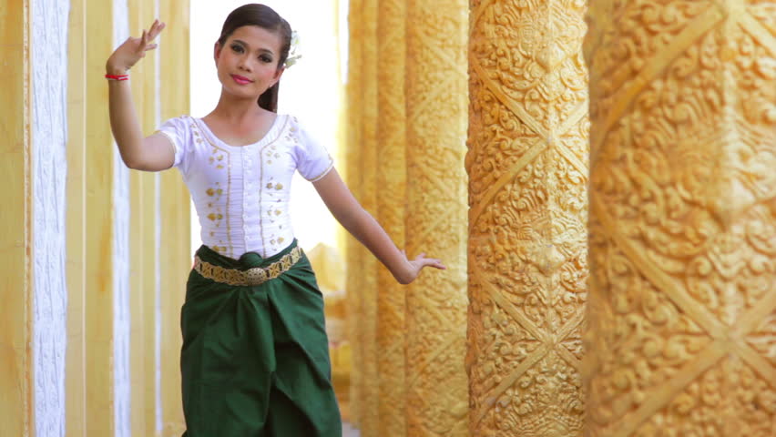 Beautiful Asian Girl performs Cambodian folk dance in the afternoon
