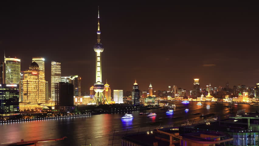 Shanghai night time-lapse. Shanghai skyscrapers and Huangpu river, China. 