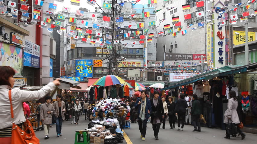 SEOUL, SOUTH KOREA - APRIL 22, 2012 Cheap Clothes Sales, Asian Shopping, Seoul Market Street, Shoppers, South Korea