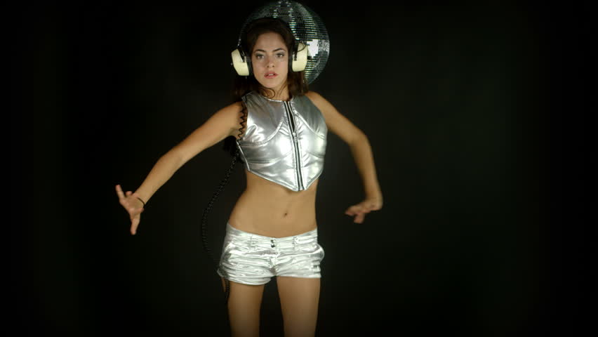 sensual studio shoot of a beautiful woman dancing in a silver outer space style costume