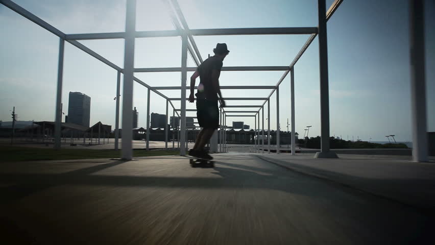 cool guy on his longboard  skate in a great park en Barcelona, Spain.
