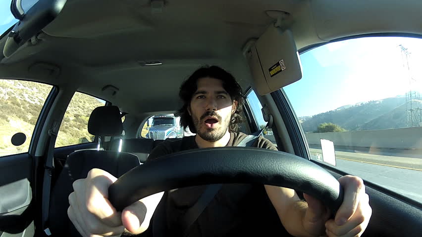 Tired young driver yawning