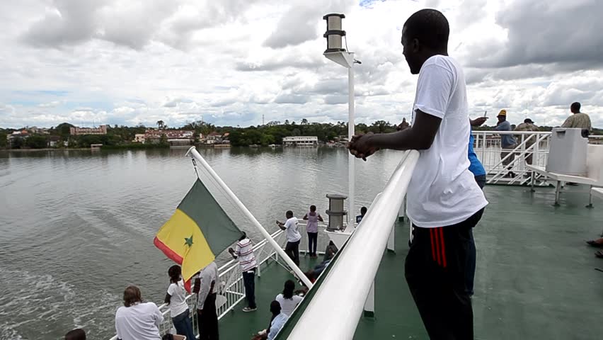 ZIGUINCHOR, SENEGAL - SEPTEMBER 29: Passengers aboard the new ferry between Ziguinchor and Dakar on September, 29 2012 in Ziguinchor, Senegal. The old ship sank in 2002, killing at least 1,863 people.