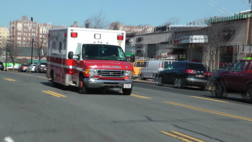 WASHINGTON, DC - CIRCA FEB. 2012: Fire Department Fire EMS races past street, siren blaring, responding to a call. EMS is part of the Fire  Department in Washington - DC FEMS.